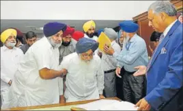  ?? KESHAV SINGH/HT ?? Former chief minister Parkash Singh Badal and his son Sukhbir Singh Badal arriving at the speaker’s office to take oath at the Punjab Vidhan Sabha in Chandigarh on Monday.