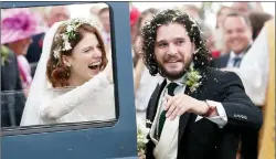  ?? AP PHOTO ?? Actors Kit Harington and Rose Leslie react as they leave after their wedding ceremony, at Rayne Church, Kirkton of Rayne in Aberdeensh­ire, Scotland, Saturday.