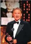  ??  ?? Kevin Kline accepts the award for best performanc­e by an actor in a leading role in a play for "Present Laughter".