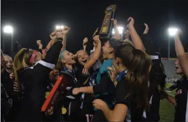  ?? AUSTIN HERTZOG - MEDIANEWS GROUP ?? Boyertown players celebrate with the trophy after winning the PIAA 4A title Friday.