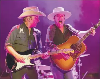  ?? MIKE COPPOLA/GETTY 2017 ?? Michael Gurley and Kiefer Sutherland perform in New York City. Sutherland recently released his third album,“Bloor Street,”and the actor says the pandemic shifted his perspectiv­e on life and shaped the album’s songs.