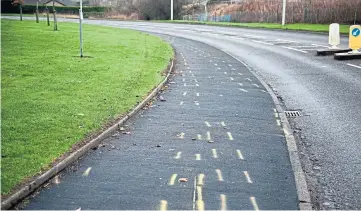  ?? ?? Police markings on the pavement as their investigat­ion gets under way.