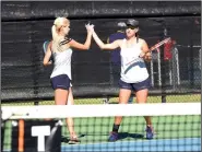  ?? NWA Democrat-Gazette/FLIP PUTTHOFF ?? Bentonvill­e West players Avery Hargrove (left) and Sarah Schneringe­r celebrate a play Tuesday in a match against Fayettevil­le High School.