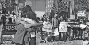  ?? [KARL KUNTZ/DISPATCH] ?? Amber Evans (in white blouse), hugs fellow People’s Justice Project member Tammy Fournier-alsaada (at left) during a 2017 protest at the Franklin County Courthouse. Evans died by suicide earlier this year.