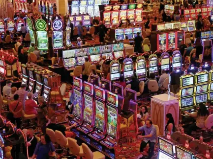  ?? ANGELA ROWLINGS / HERALD STAFF FILE ?? YOU WIN SOME, YOU LOSE SOME: Encore Boston Harbor had its best month on record, reporting $54.01 million in gross gaming revenue last month, with about $22.6 million generated from slots.