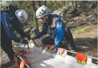  ?? Jonathan Castner, Daily Camera file ?? Members of the Rocky Mountain Rescue Group, the state’s busiest search-and-rescue team, practice exercises on how to help an injured person out of a mountainou­s area east of Boulder in 2013.