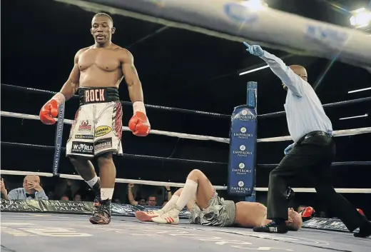  ?? / FRENNIE SHIVAMBU ?? Thabiso ‘The Rock’ Mchunu walks away after flattening Ricards Bolotniks of Latvia in the sixth round at Emperors Palace on Saturday night. Mchunu next meets Thomas Oosthuizen in September in an eagerly awaited bout.