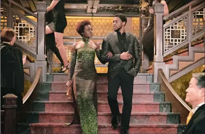  ??  ?? Lupita Nyong’o, left, and Chadwick Boseman star in “Black Panther.”