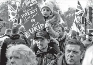  ?? ANDREW TESTA/NEW YORK TIMES ?? A pro-Brexit demonstrat­ion takes place in central London on Sunday. Anti-Brexit rallies also were staged. The British Parliament votes Tuesday on the issue.