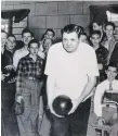  ??  ?? Bill Harvey, right seated in white shirt, keeps score for the legendary New York Yankee, Babe Ruth, who was bowling at Bronxville Lanes in 1944.