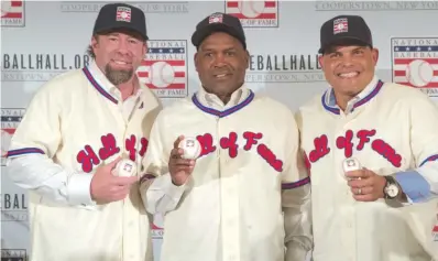  ??  ?? Jeff Bagwell ( from left), Tim Raines and Ivan Rodriguez are ready for their Hall of Fame induction Sunday. | MARY ALTAFFER/ AP