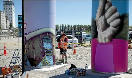  ?? PHOTO: ALDEN WILLIAMS/STUFF ?? Jacob Yikes works on one of three permanent street art fixtures at the East Frame youth zone in Christchur­ch.