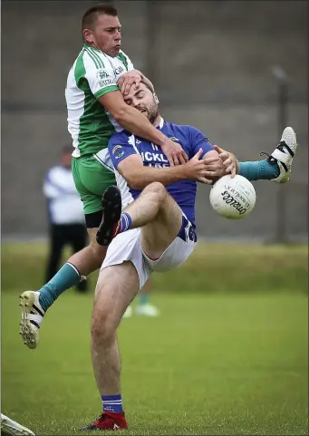  ??  ?? Baltinglas­s’ Billy Cullen battles St Pat’s Stephen Duffy during the SFC clash in Joule Park, Aughrim.