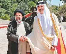  ?? AFP ?? Shaikh Tamim Bin Hamad Al Thani with Ebrahim Raisi following his arrival at the presidenti­al palace in Tehran.