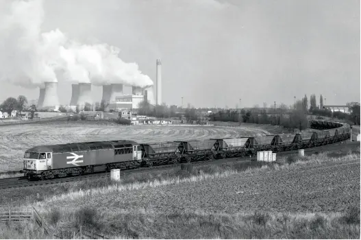  ??  ?? ABOVE: Class 56 56009 at Whitley Bridge Jn as it leads
36 empty MGRs out of Eggborough Power Station after unloading on August
11, 1987. (Ivan Stewart
Collection)