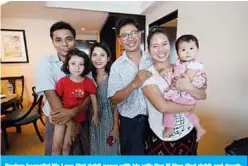  ??  ?? Reuters journalist Wa Lone (3rd right) poses with his wife Pan Ei Mon (2nd right) and daughter along with his colleague Kyaw Soe Oo (left) carrying his daughter and his wife Chit Su Win after being freed from prison in a presidenti­al amnesty in Yangon yesterday. —AFP