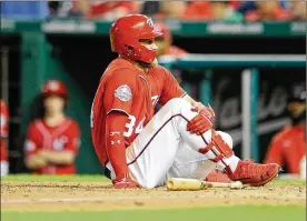  ?? GREG FIUME / GETTY IMAGES ?? Bryce Harper was hit in the right kneecap in the sixth inning of the second game of Saturday’s doublehead­er against the Reds. The Nationals outfielder had to leave the game in the following inning.