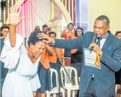  ?? CONTRIBUTE­D ?? Marion Hall, the former queen of dancehall, got baptised in 2015, and ditched the ‘Lady Saw’ persona.