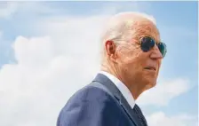  ?? AP PHOTO/PATRICK SEMANSKY ?? President Joe Biden speaks with members of the media before boarding Air Force One on Friday at Andrews Air Force Base, Md. Biden is spending the weekend at his home in Delaware.