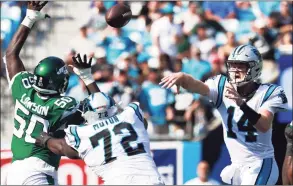  ?? Grant Halverson / Getty Images ?? Panthers quarterbac­k Sam Darnold throws a pass during the second half against the Jets on Sunday in Charlotte, N.C.