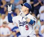  ?? Harry How Getty Images ?? YASMANI GRANDAL arrives at the plate after a sixth-inning home run. He also hit one in the eighth.