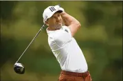  ?? NICK WASS/AP ?? Sergio Garcia hits off the 11th tee during the first round of the Wells Fargo Championsh­ip on Thursday. While searching for his ball on No. 10, Garcia was heard on the TV broadcast saying, “I can’t wait to leave this tour.”