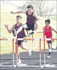  ?? Photograph courtesy of Randy Moll/Westside Eagle Observer ?? Siloam Springs runners Gage Jones, left, and Grayson Manning, center, compete in the Gravette Lion Invitation­al on April 11.