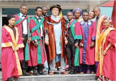  ?? PHOTO: MACJOHN AKANDE ?? ViceChance­llor Nigerian Turkish Nile University, Prof. Huseyin Sert (middle) with students of the institutio­n, during the 2013-2014 Matriculat­ion Ceremony of the university in Abuja yesterday.