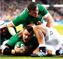  ??  ?? Roar: Cian Healy scores Ireland’s first try