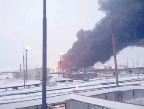  ?? — Reuters ?? Smoke billows after Ukraine’s SBU drone strikes a refinery, Ryazan Region, Russia.