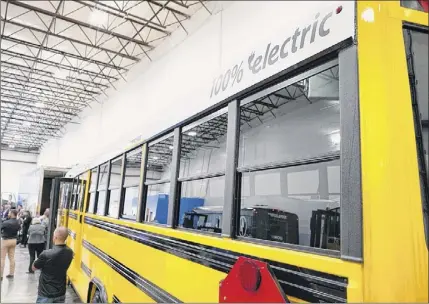  ?? Paul Buckowski / Times Union ?? An electric school bus is in the spotlight for The Lion Electric Co. in Green Island in 2019.
