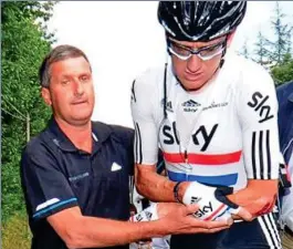  ??  ?? Crash: Freeman tends to Wiggins after 2011 Tour de France fall