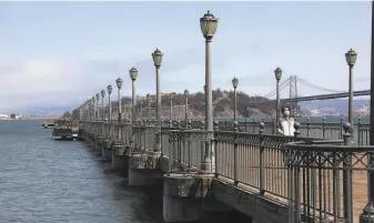  ?? Liz Hafalia / The Chronicle ?? An earthquake on the scale of the 1906 temblor would cause extensive damage to the Embarcader­o’s historic finger piers, some of which are built on loose sand below landfill.