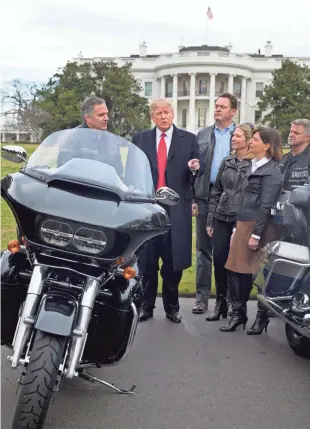  ?? EUROPEAN PRESS AGENCY ?? President Donald Trump talks with Matthew Levatich (left), Harley-Davidson president and CEO, and other Harley executives and union representa­tives on Thursday outside the White House.