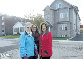  ?? NIAGARA FALLS REVIEW FILE PHOTO ?? Niagara Falls wants to take advantage of a provincial program that offers developmen­t charge rebates on new, purpose-built affordable rental housing to encourage more constructi­on. Gateway Residentia­l and Community Support Services of Niagara opened its first affordable housing complex in Niagara Falls in October 2016. Gateway's Barbara Robinson, Shelly Mousseau, and Patty Berard, were on hand to check out the new building on Huron Street.