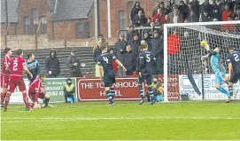  ?? Picture: Dougie Nicolson. ?? Tom O’Brien makes it 1-0 Arbroath.