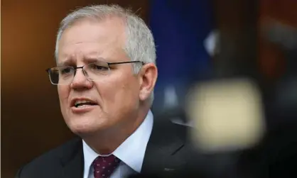  ?? Photograph: Mick Tsikas/AAP ?? The Morrison government has argued the Fair Work Commission should ‘take a cautious approach’ to raising the minimum wage.