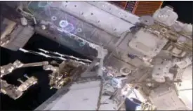  ??  ?? This still image taken from video provided by NASA shows astronaut Shane Kimbrough, right, as he works on the Internatio­nal Space Station during a space walk Friday.