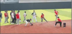  ?? Daniel Bereznicki/McDonald County Press ?? Players go through drills to see if they have the potential to make the cut. Coaches toss ground balls to see how they react and catch.