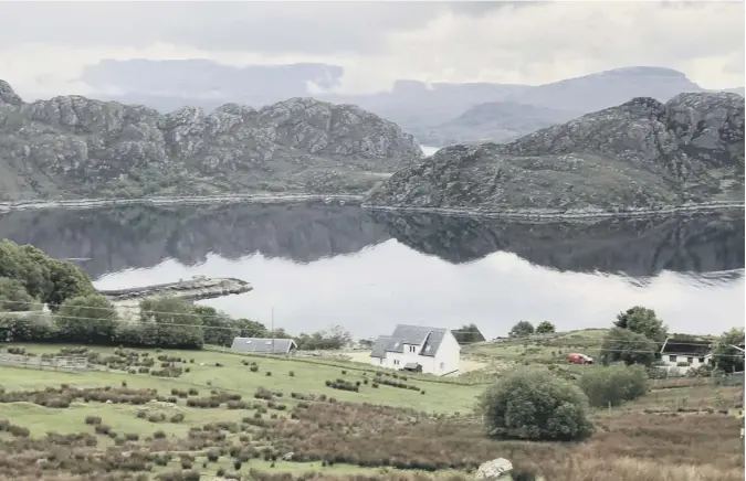  ??  ?? 0 Reader JC Niven contribute­s this image of a still Highland vista and writes: ‘Wester Ross on a cold, calm day, looking out to Loch Torridon.’