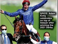 ?? ?? SPICE: Adam Kirby celebrates on top of Adayar after winning the 2021 Derby