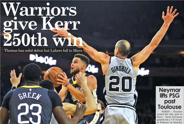  ?? ASSOCIATED PRESS ?? Golden State Warriors' Stephen Curry, center, looks to shoot past San Antonio Spurs' Manu Ginobili during the first half of an NBA basketball game in Oakland, Calif.