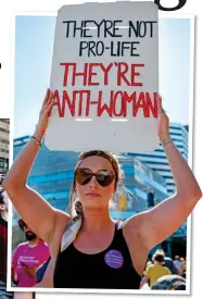  ?? ?? ‘DARK DAY’: Protesters take to the streets in Boston, Massachuse­tts, left, and in Portland, Oregon, above