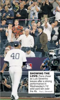  ?? Paul J. Bereswill ?? SHOWING THELOVE: Fans cheer as Luis Severino leaves after a strong performanc­e in Wednesday’s 7-2 wild-card win over the A’s.