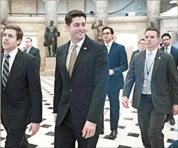  ?? SHAWN THEW/EPA ?? House Speaker Paul Ryan walks through Statuary Hall on his way to the House floor to vote on the stopgap funding bill.