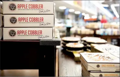  ?? NWA Democrat-Gazette/JASON IVESTER ?? A selection of Patti LaBelle apple cobbler and sweet potato pie is on display at a Wal-Mart store in Rogers.