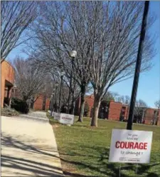  ?? COLIN AINSWORTH — DIGITAL FIRST MEDIA ?? Signs line Memorial campus. Field in the center of Widener’s