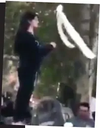  ??  ?? Symbolic: A woman, her head uncovered, waves her flag in Iran in recent days