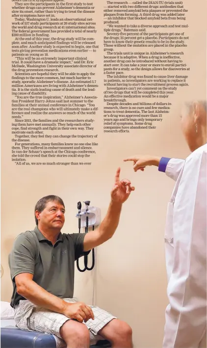  ?? CHRISTIAN GOODEN/ST. LOUIS POST-DISPATCH/TNS ?? Dean DeMoe, left, takes a neural exam at Washington University School of Medicine’s study of people living with dominantly inherited Alzheimer’s disease.