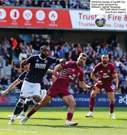  ?? ?? Dimitrios Goutas of Cardiff City is put under pressure by Millwall’s Japhet Tanganga PICTURE: Micah Crook/ Huw Evans Agency